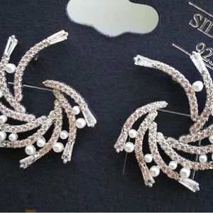 Silver earrings with small pearl. New, never worn. Will ship with jewelry box.